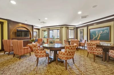 Interior view of a common area with patterned chairs