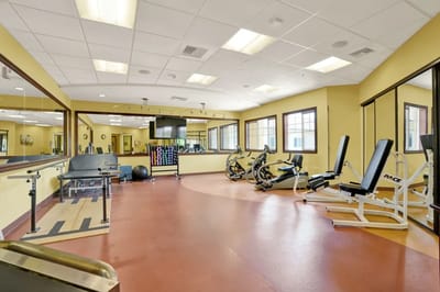 Well-equipped fitness room with exercise machines