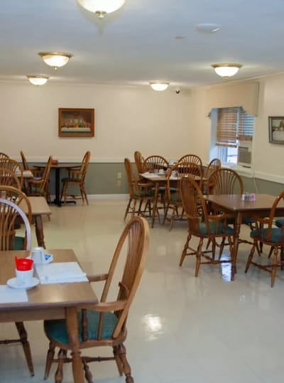 Dining area with wooden chairs and tables
