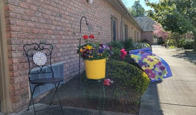 A peaceful outdoor space with flowers and seating