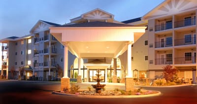 Exterior view of Evergreen Fountains with beautifully lit entrance