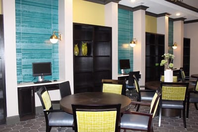 Bright common area with modern seating and decor