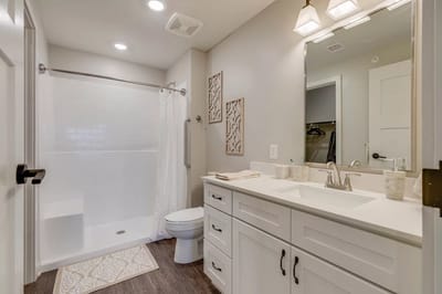 Modern bathroom with white tiles and fixtures