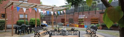 Outdoor sitting area with benches and decorations