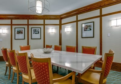 Interior view of a dining room with a large table and chairs