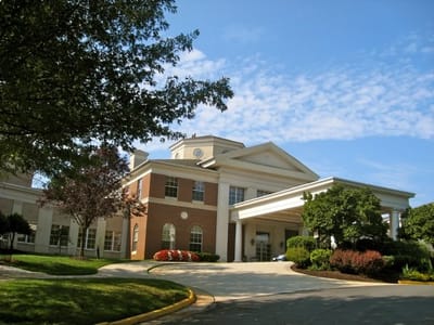 Exterior view of the facility with landscaped entrance