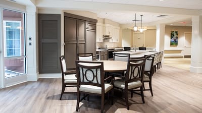 A modern dining area inside a senior living facility