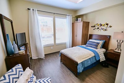 Cozy resident room with a bed and personal decor