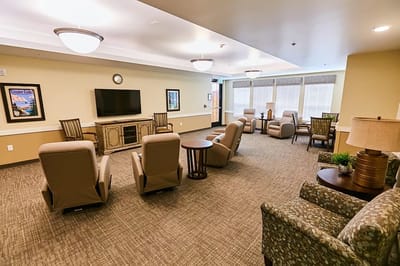 Common area with seating and a large TV