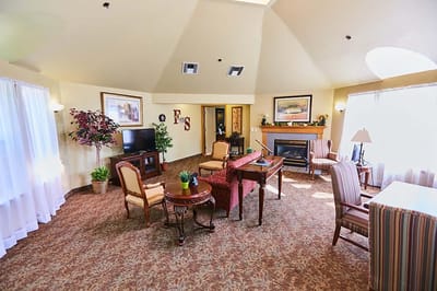 Bright common area with comfortable seating and TV