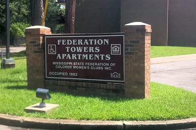 Entrance sign for Federation Towers Apartments