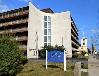 Exterior view of Fenno House with signage and landscaping