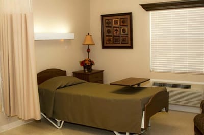 Simple interior room with bed and decorative elements