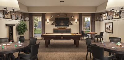 A common area with a pool table and poker tables