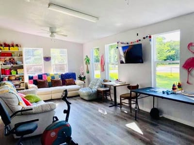 Bright common area with seating and activities