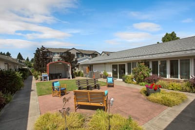 Outdoor seating area with landscaping and pathways