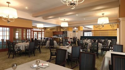 Dining room with tables ready for residents