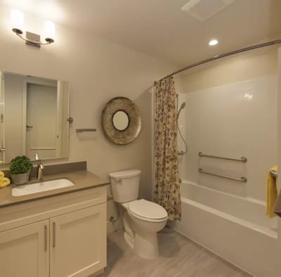Clean and modern bathroom with shower.