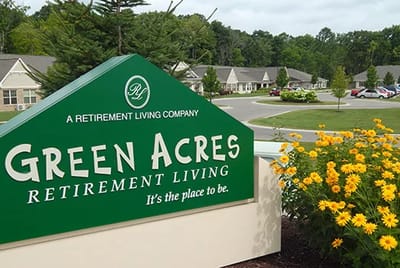 Exterior view of Green Acres facility with flowers