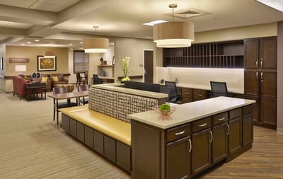 Bright common area with seating and reception desk