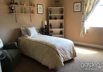 Cozy private resident room with a bed and decor