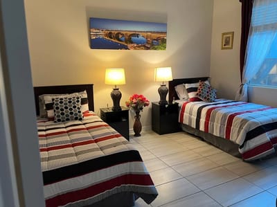 Cozy shared bedroom with twin beds and decorative artwork