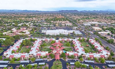 Aerial view of a senior living campus with landscaped grounds