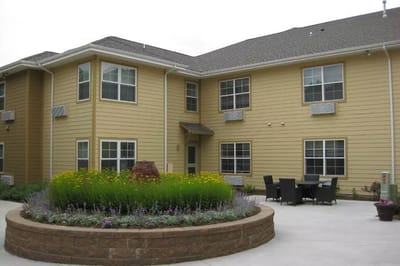 Exterior view of the facility with landscaped garden