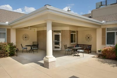 Outdoor patio area with tables and chairs
