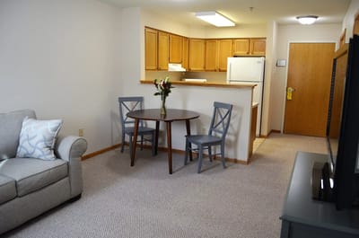 Cozy living space with kitchen area and dining table