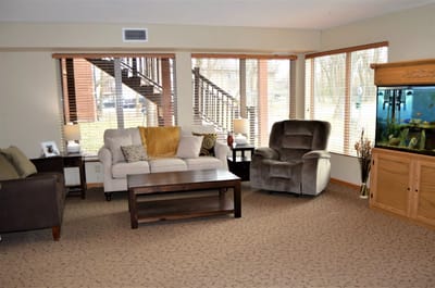 Cozy common area with comfortable seating and large windows
