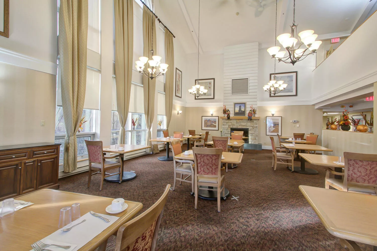 Bright dining room with tables and chairs arranged
