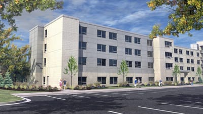 Exterior view of Gateway Vista with residents and landscaping