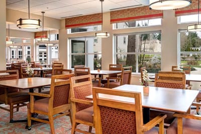 Interior view of a dining room with wooden furniture