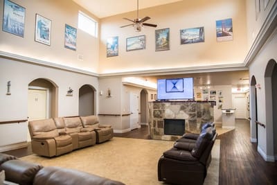 Common area with seating and artwork on the walls