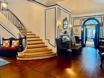 Interior view of a cozy common area with a staircase