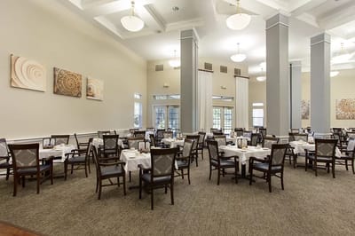 Dining area with tables set for residents