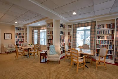 Bright common area with bookshelves and seating