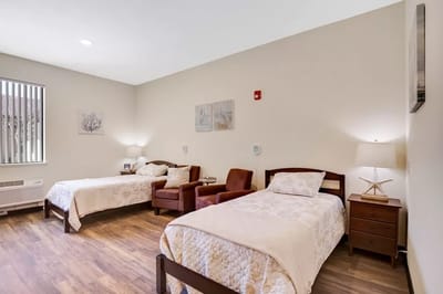 Bright interior of a shared resident room with two beds