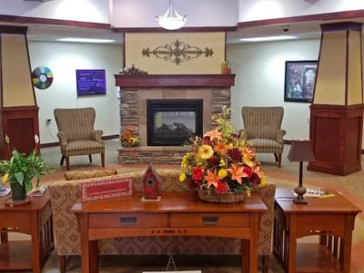 Cozy lobby area with a fireplace and seating