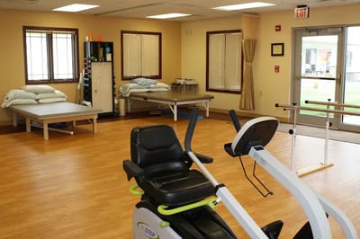 Interior view of a therapy room with exercise equipment