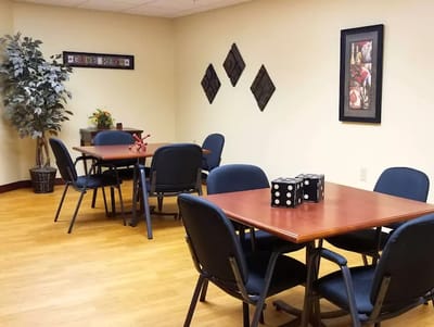 A cozy common area with tables and chairs