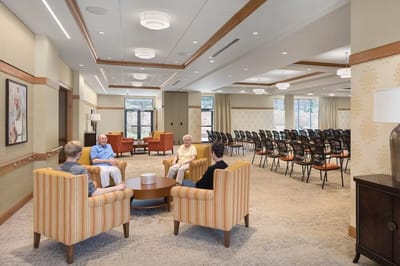 Residents socializing in a common lounge area