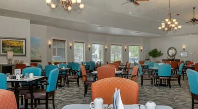 Interior view of a dining area with tables and chairs