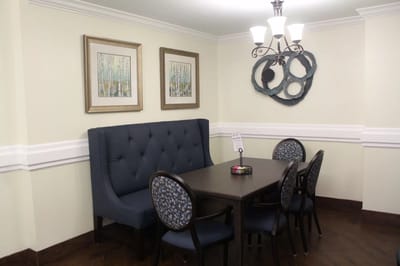 Interior dining space with seating and artwork
