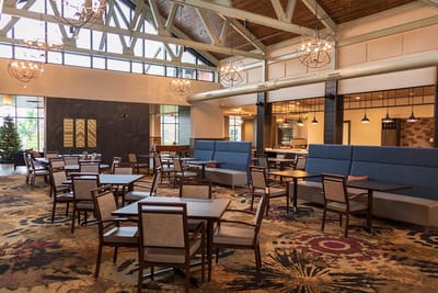 Bright dining area with tables and chairs