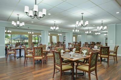 Bright dining room with wooden tables and chairs