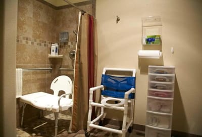 Accessible bathroom with shower and chairs