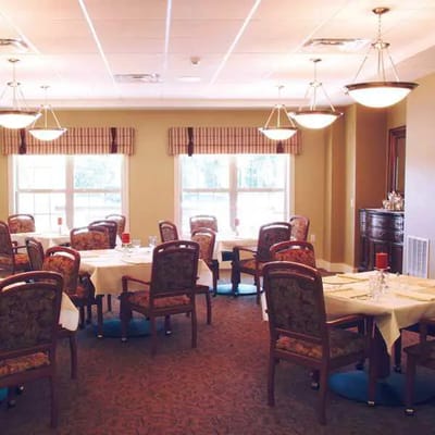 Dining room with tables set for residents