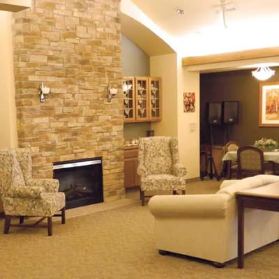 Cozy interior lounge area with seating and fireplace